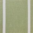 Reversible side of Easton rug showing an inverted color scheme with green center and ivory border