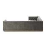 Long back view of sectional emphasizing low-profile design and fabric texture