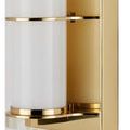 Close-up of polished brass metal ring and milky glass tube junction on Blaine wall sconce