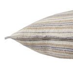 Side close-up showing textured linen fabric and soft filling of striped pillow