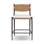 Outdoor counter stool with woven Liller Flax backrest and seat, black metal frame, and white cushion
