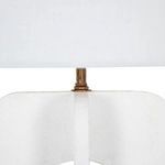 Close-up of antique bronze metal fitting attaching shade to lamp base