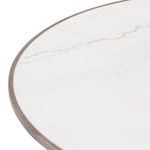 Close-up of marble tabletop surface showing subtle veining and oak edge band