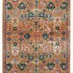 rectangular indoor/outdoor rug with a faded medallion design in warm pink, gold, turquoise, and cream tones