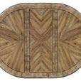 Top view showing wood grain pattern with one 20-inch leaf extending the oval table length