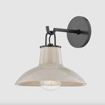 Pottersville Wall Sconce side angled view on white background highlighting smooth beige glaze and bulb