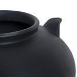 Close-up angled view showing one handle and the vase’s curved shoulder
