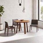Three Deco Dining Chairs arranged around round wooden dining table in minimalist room with pendant lights.