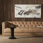 Wall-mounted Illumination IV By Matera painting with walnut frame in styled living room setting with leather couch