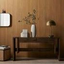 Nador rug partially visible beneath dark wooden console table with decorative vase and lamp