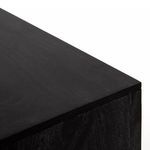 Close-up of black mango wood grain on black sideboard top with smooth matte finish