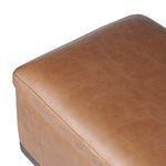 Close-up of smooth leather corner with stitching and top edge on trunk