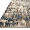 Side angle showing low pile texture and thickness of Spirit Stone Blue Rug with muted color transitions