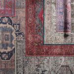 Multiple rugs layered and arranged showing color variations and design differences including the Gloria medallion rug