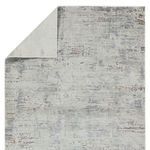 Back and top corner of rug flipped to display reverse side and backing texture