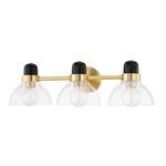Three-light bath bracket with clear glass shades, black and gold metal accents, and a central gold wall mount