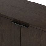 Top-down close-up of dark rubbed black oak wood surface with visible grain