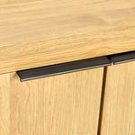 Black metal handles integrated at top edge of each door contrasting natural oak wood