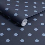 rolled wallpaper showing matte texture and baby blue polka dots on navy background