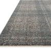 Side angle view highlighting the thin profile and tight weave of the Ember Denim Charcoal rug