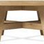 Round cocktail table showing front view with X-stretcher base and angled legs
