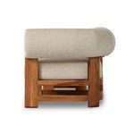 Close-up of the teak wood frame curve detail under cushioned seat