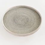 Top view showcasing circular woven pattern and textured surface of the serving stand