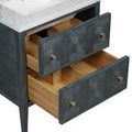 Open-drawer angle with visible under-sink plumbing space and brass knobs