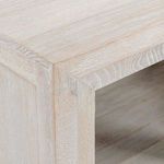 Close-up detail of oak wood grain and corner joinery on cabinet top edge