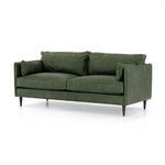 Side angled view showing mid-century modern almond tapered legs and arm profile