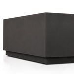 Side detail of plinth base showing shadow under elevated platform