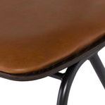 Close-up of smooth leather seat cushion and stitching detail along edge