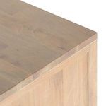 Three drawers extended fully open showing cane fronts and wood interior