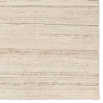 Macro view of rug surface highlighting fine horizontal stripes and detailed wool fibers