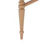 Close-up of hand-carved almond cerused oak tapered leg with ring and bead details