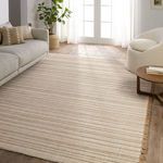 Rug positioned in bright living room with wood floors, sofa, and natural light