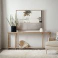 Vera Cruz Console Table styled in a living room with decor accents, light walls, and a cozy white rug