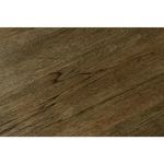 Brown oak veneer table corner showing layered wood texture and smooth edges