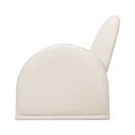 Side profile of Nicola chair highlighting its broad armrest and gently sloping backrest