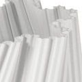 Close-up showing detailed ribbed texture and scalloped porcelain edges of the vase’s open top