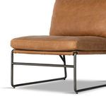 Detailed view of metal frame under front seat cushion with cylindrical bars and matte finish