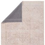 Corner flipped over to reveal gray non-slip backing and edge stitching details