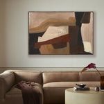 Painting displayed on white wall above tan leather sofa with round coffee table and decorative items