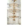 Side view of the chandelier suspended on chain showing the three tiers and glass bars without lighting