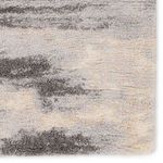 Detailed view of rug surface with abstract gray and cream shading showing pile density and color mixing