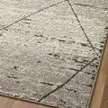 Angled close-up showing pile variation and charcoal diamond pattern on Fabian Grey Rug