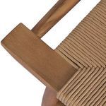Close-up of tapered leg joining flat wooden stretcher beneath wicker seat