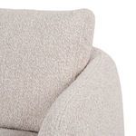 Close-up of plush armrest and upper seat side seam in bouclé fabric