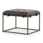 Side angle showcasing leather surface texture and metal frame joinery