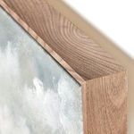 Close-up of the wood grain texture on the thick frame edge of the painting
